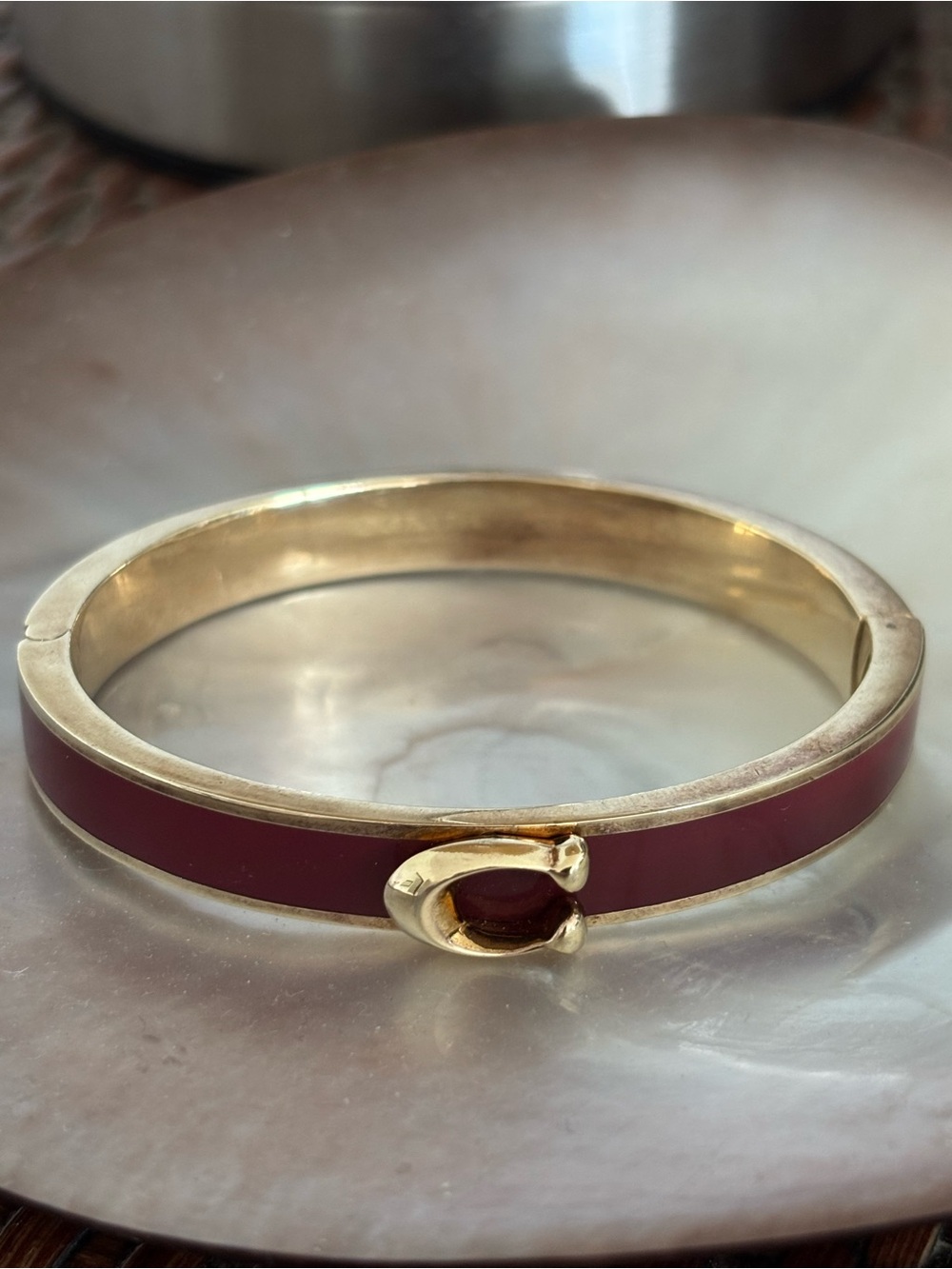 COACH Gold-Tone Bracelet with Deep Red Enamel Accent